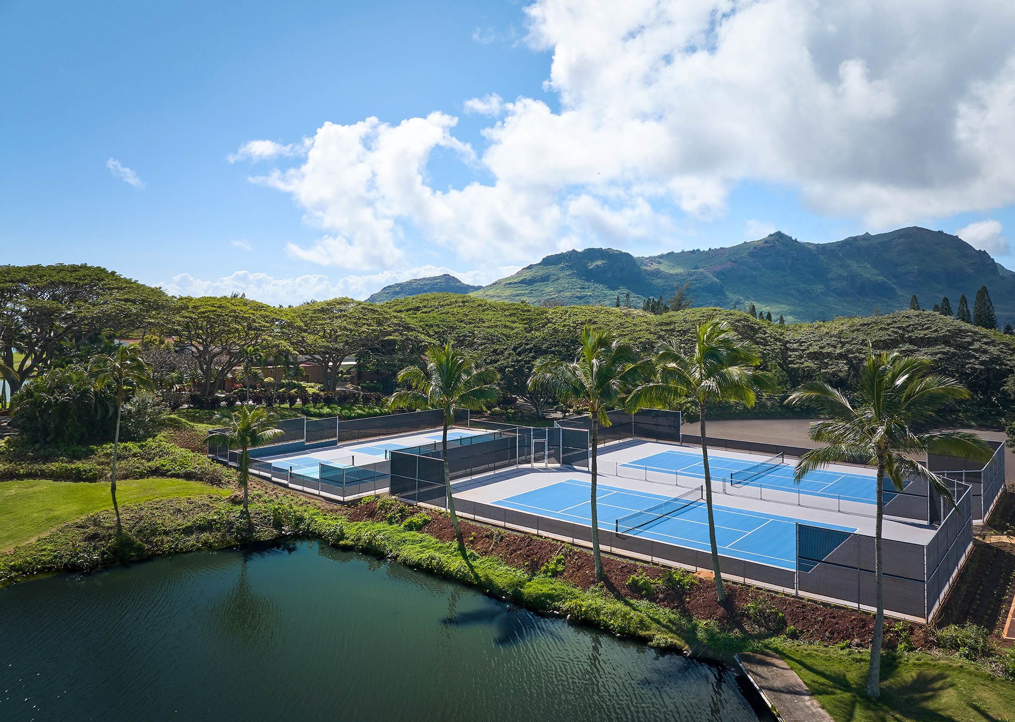 Aerial view of the Courts at Hokuala (tennis and pickleball) with the Haupu Mountains in the background
