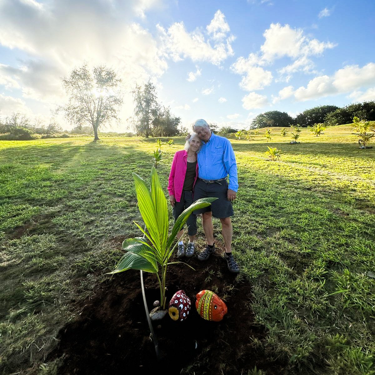 The Ortens by their coconut tree at Hokuala
